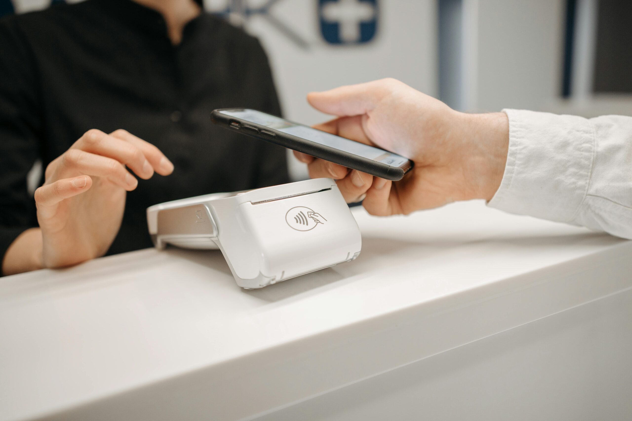 Person paying at a counter.